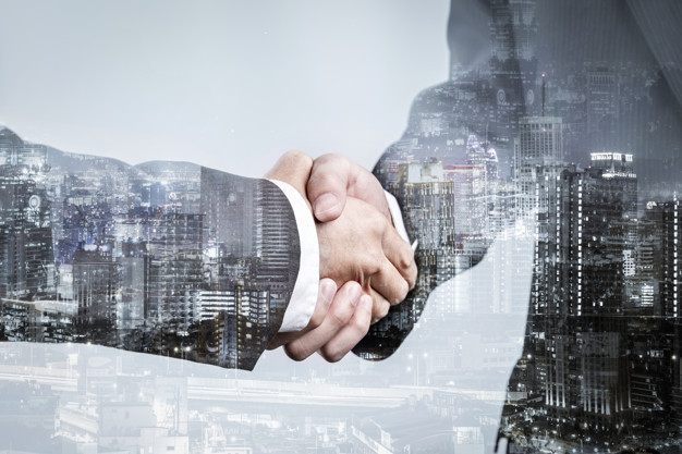 double-exposure-business-partnership-handshake-modern-city-successful-business-greeting-agreement-after-perfect-deal_39665-134.jpg